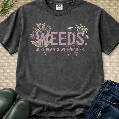 Weeds Just Plants With Bad PR t-shirt featuring Milkweed and Queen Anne's Lace botanical illustrations on a vintage washed charcoal shirt.